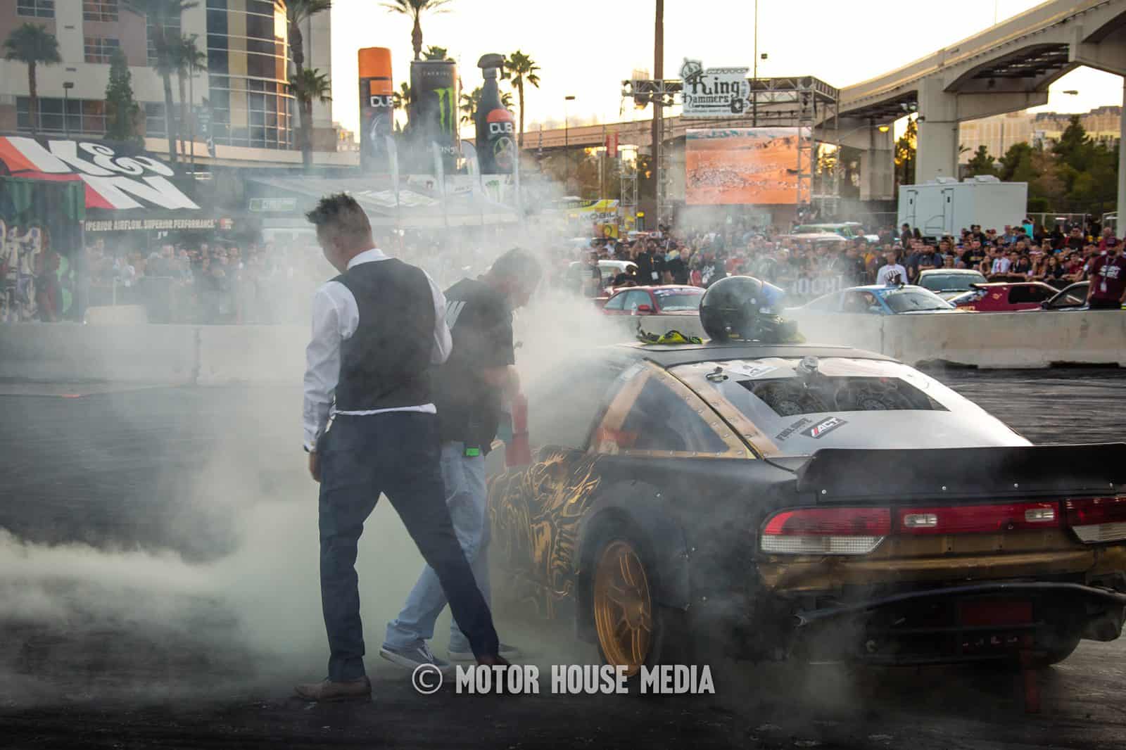 Fire being extinguished on Spike Chen's Drift car at Hoonigan